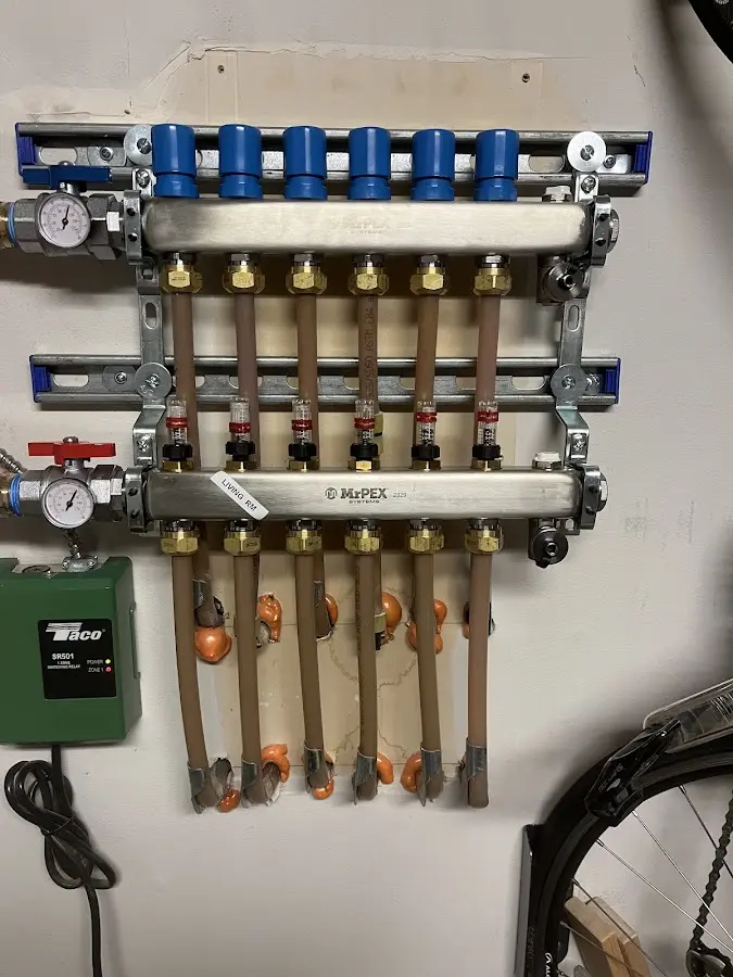 Plumber performing Water Heater Repair at a residential property in Bangor Base